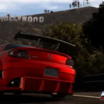 Chiếc Mazda RX-7 màu cam trong Midnight Club: Los Angeles trên đường phố với biển hiệu Hollywood phía sau, minh họa cho sự đa dạng game đua xe mà Rockstar có thể mang lại.