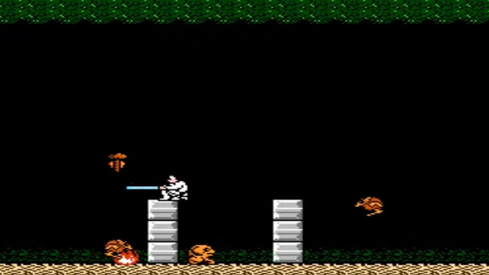 Gameplay của game Star Wars trên NES, hiển thị một cảnh chiến đấu pixelated
