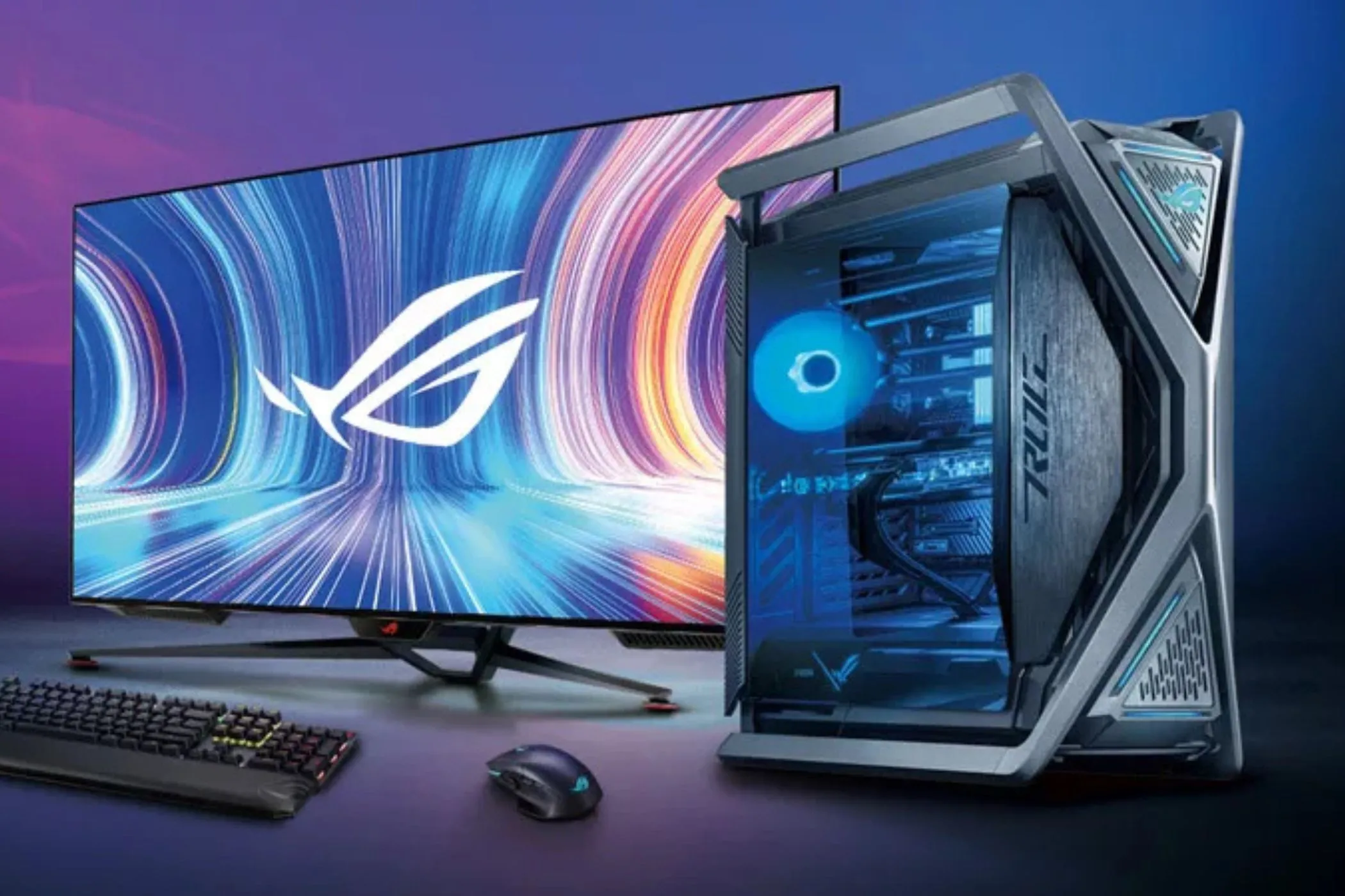 Góc chơi game PC với màn hình lớn và bàn phím cơ