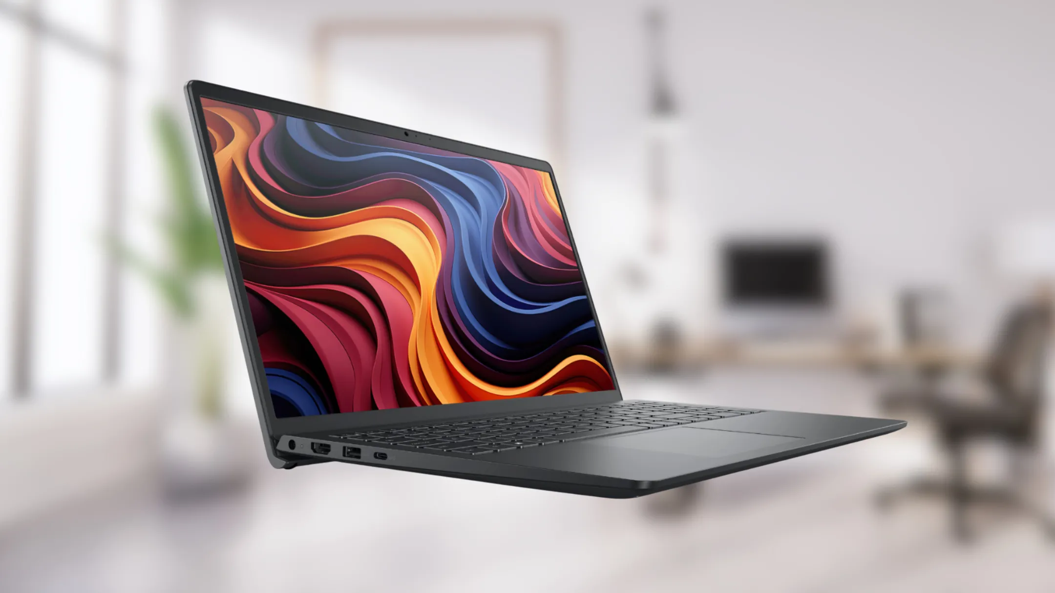 Góc nhìn cận cảnh laptop Dell 15, cho thấy cổng kết nối và màn hình rộng 15.6 inch.