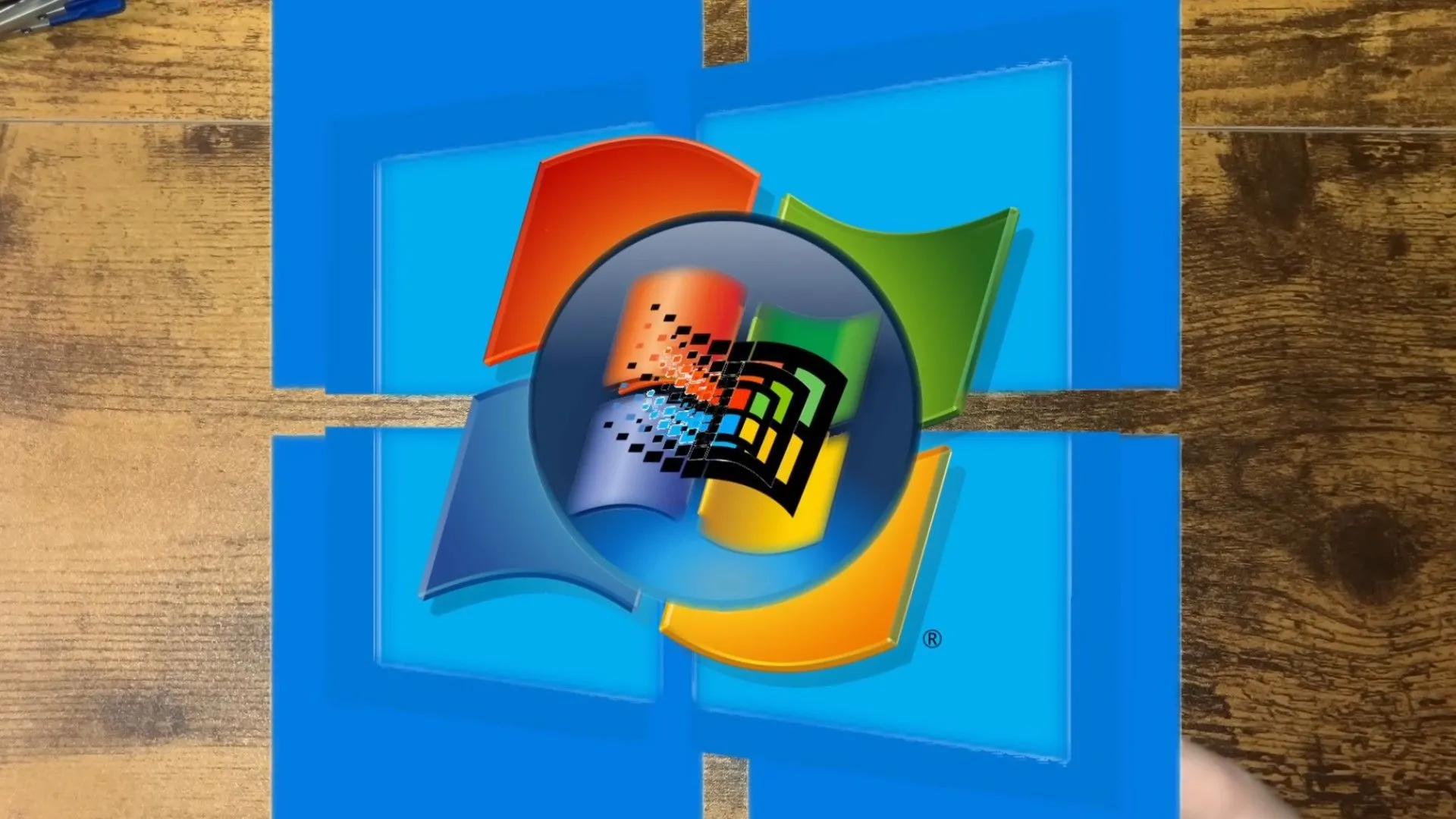 Hình ảnh minh họa các biểu tượng phiên bản Windows cũ và mới, thể hiện mục tiêu chạy máy ảo Windows lồng nhau.