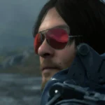 Hình ảnh nhân vật Sam Bridges trong game Death Stranding đeo kính râm, chuẩn bị cho chuyến giao hàng đầy thử thách.