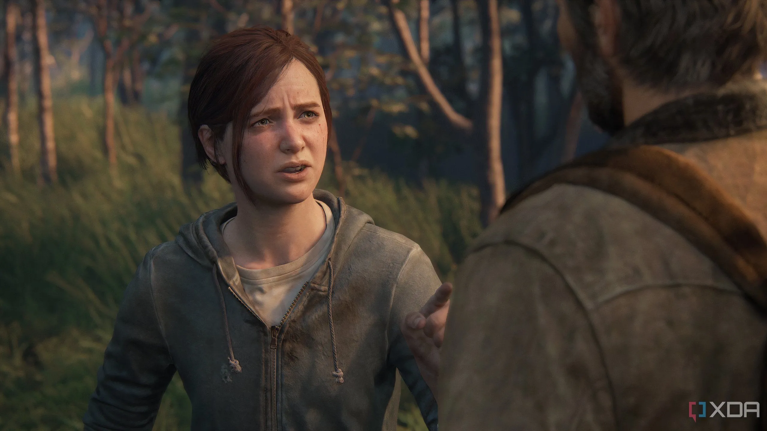 Một cảnh chụp từ game The Last of Us Part II Remastered trên PC, thể hiện cuộc đối thoại đầy cảm xúc giữa Ellie và Joel, một khoảnh khắc quan trọng của cốt truyện.