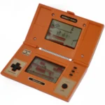 Thiết bị chơi game cầm tay Nintendo Donkey Kong Game & Watch, tiền thân của D-pad trên tay cầm NES.
