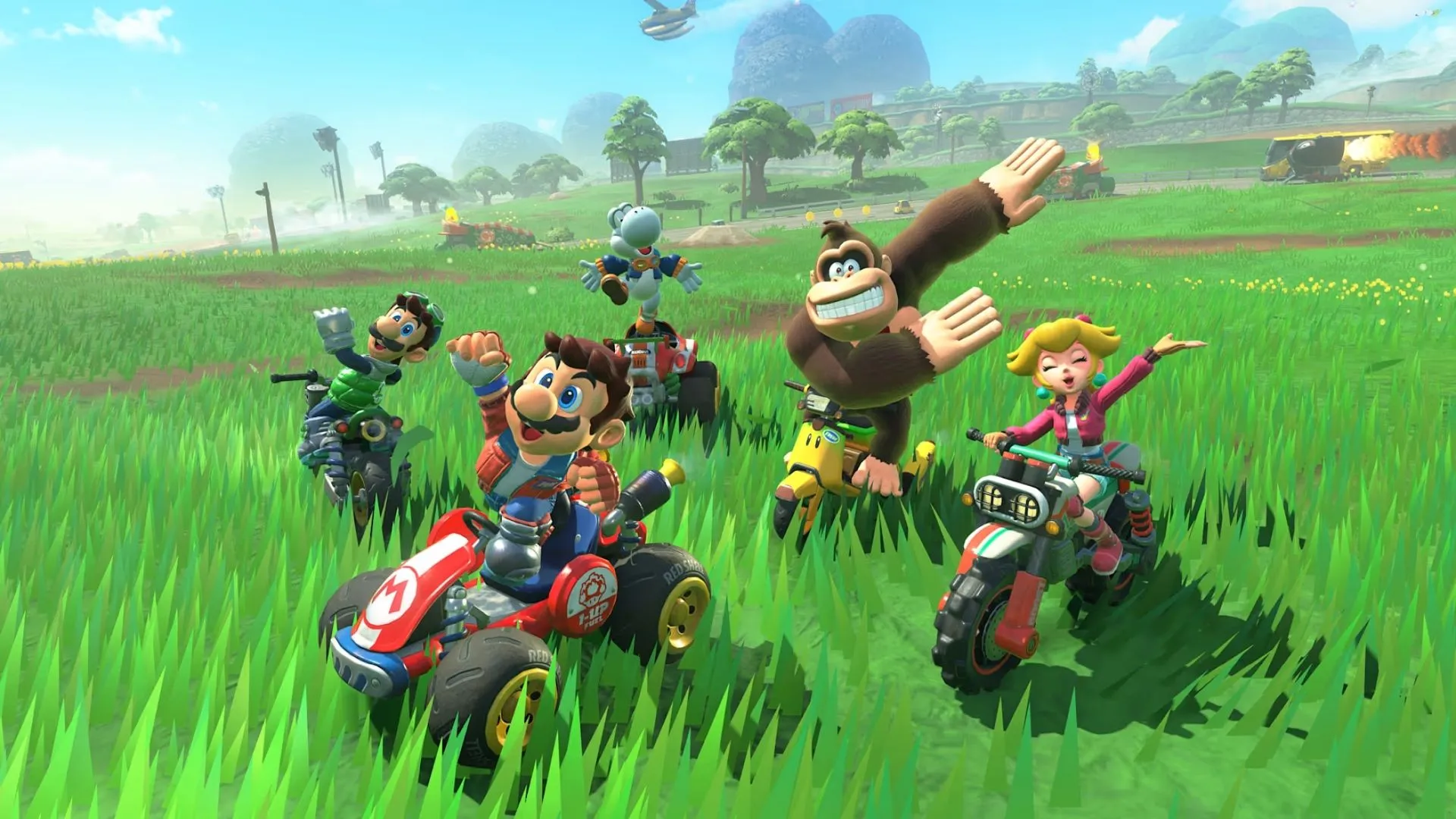 Yoshi và Bowser Jr. đua trên đường đua chủ đề núi tuyết trong Mario Kart World